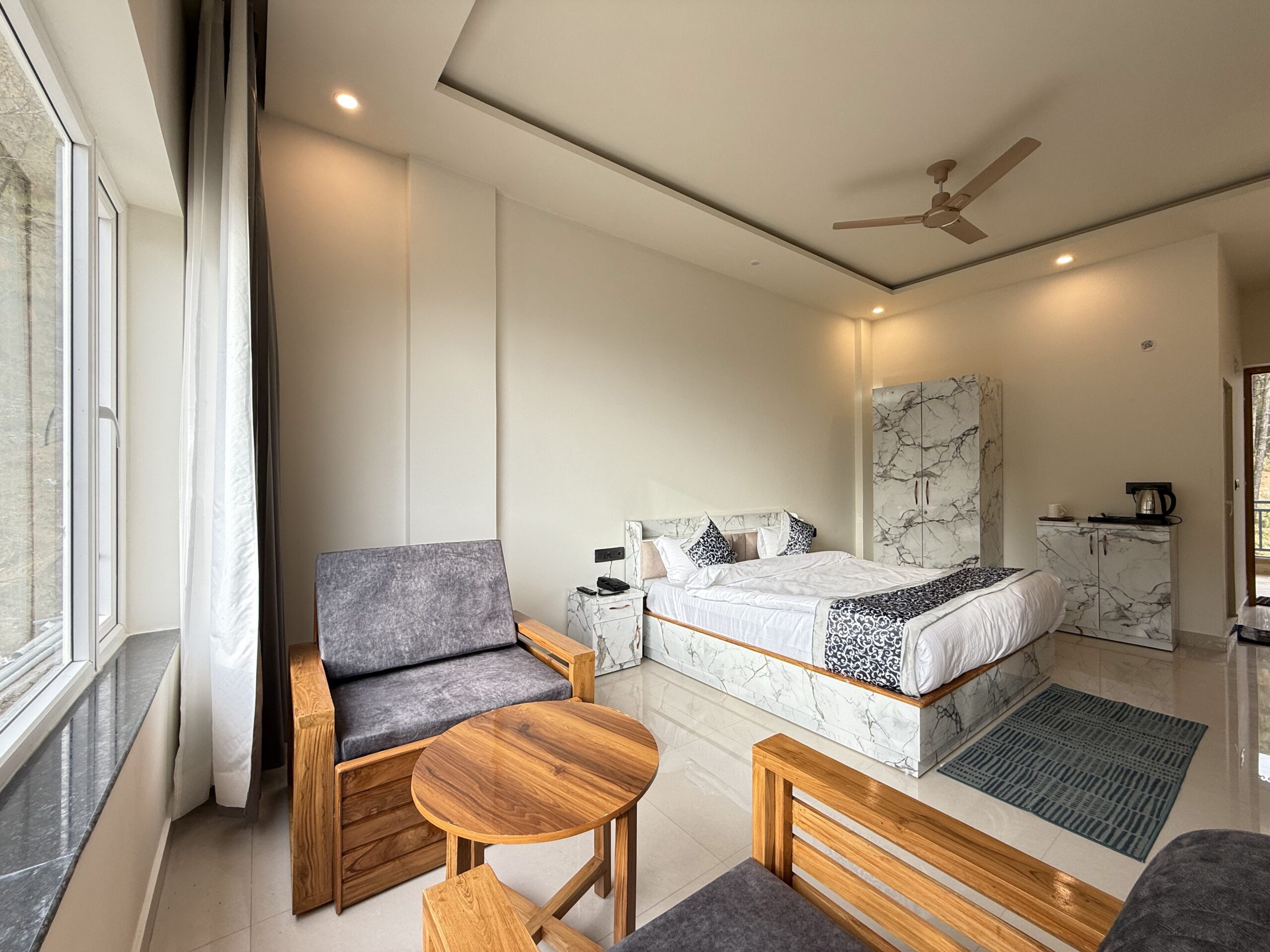 Wake up to misty mountain vistas from your private balcony. This queen-bed room is wrapped in warm wood tones with traditional Garhwali hand-woven accents.facilities.